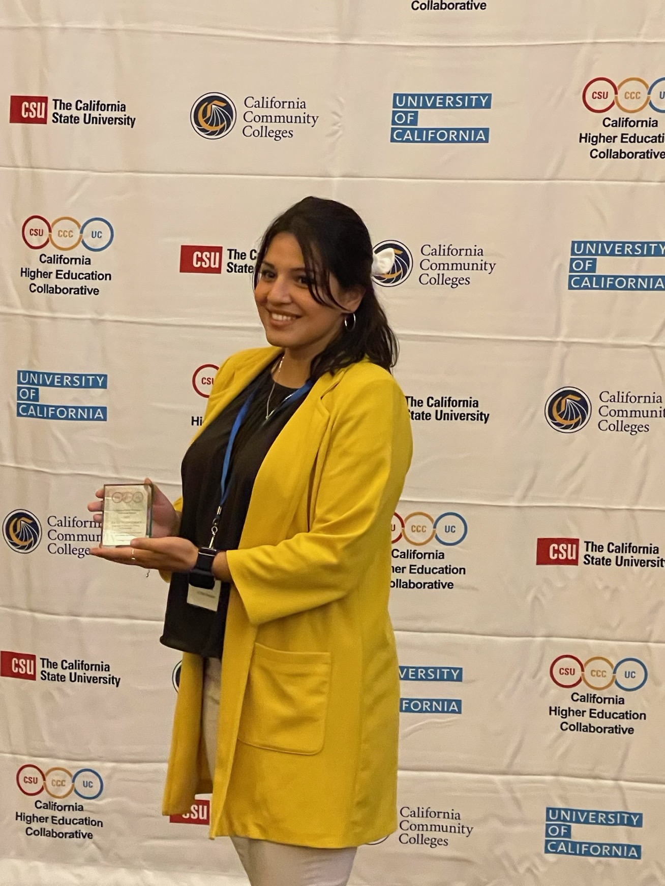 Sami Gonzalez wearing a yellow jacket at the CHEC Conference